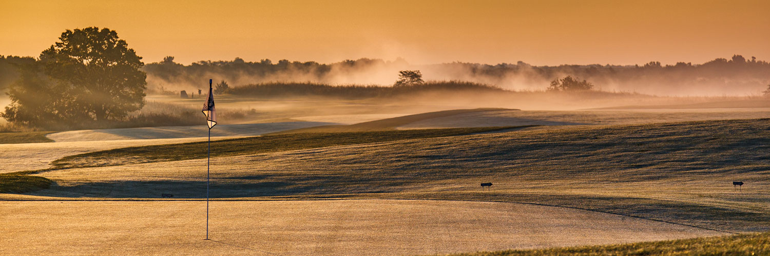 Golden morning light on a golf green at The Preserve on Rathbun Lake at Honey Creek Resort