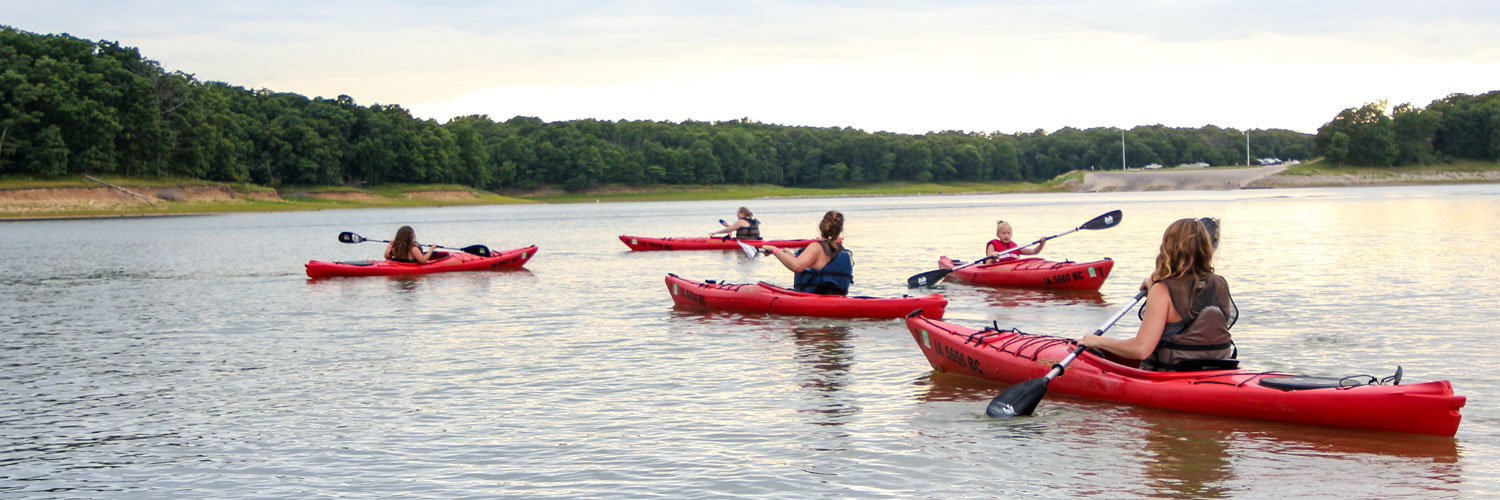 Group of people kayaking on a lake