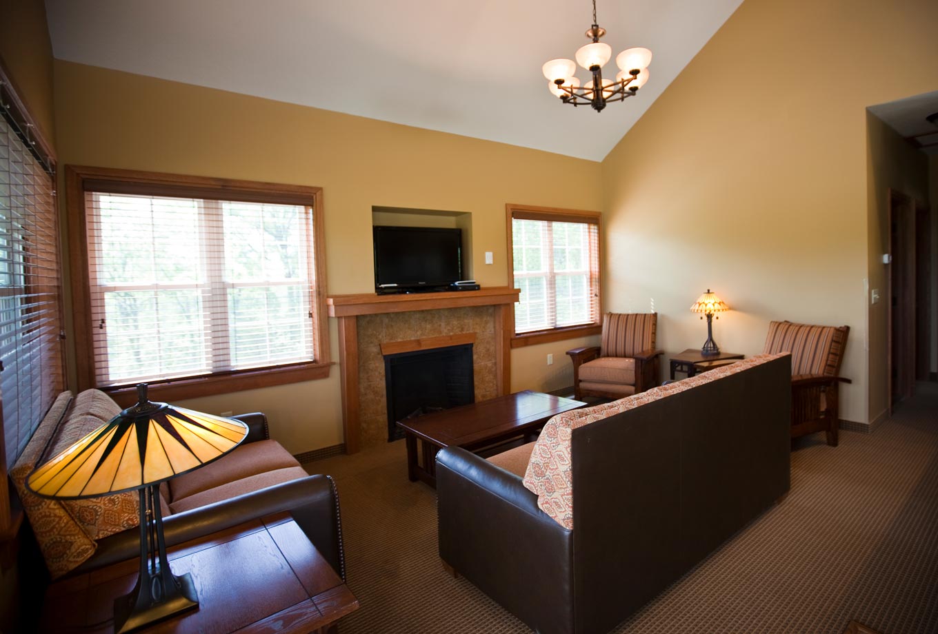 Comfortable interior of a cottage at Honey Creek Resort with fireplace