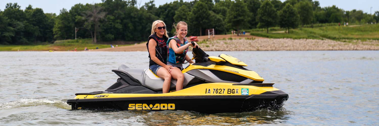 Guests enjoy a jet ski rental from Honey Creek Resort on Rathbun Lake