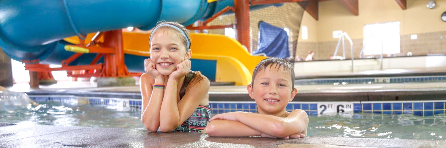 Two kids at Buccaneer Bay, Honey Creek Resort's indoor water park 1.5 hours from Des Moines, Iowa