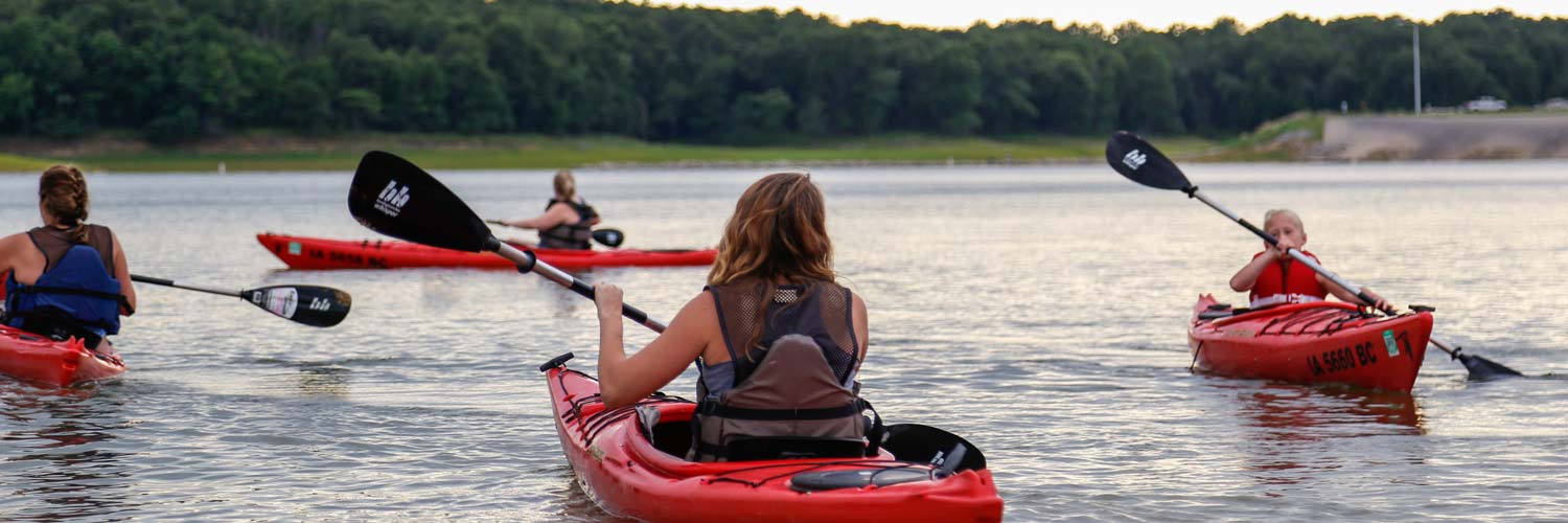 Guests enjoy kayaking together on Rathbun Lake at Honey Creek Resort
