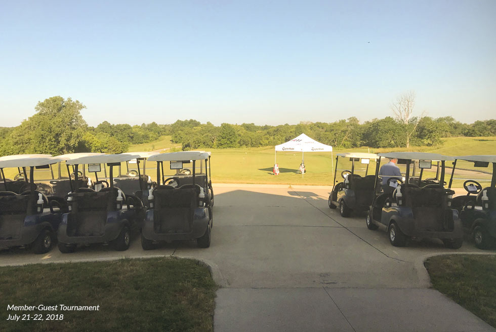 View of golf carts and a tent at The Preserve on Rathbun Lake during the 2018 Member-Guest Tournament