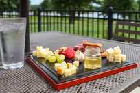A delicious cheese platter is served outside Rathbun Lakeshore Grille at Honey Creek Resort