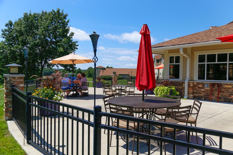 Guests enjoy outdoor dining at Rathbun Lakeshore Grille at Honey Creek Resort