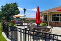 Guests enjoy outdoor dining at Rathbun Lakeshore Grille at Honey Creek Resort