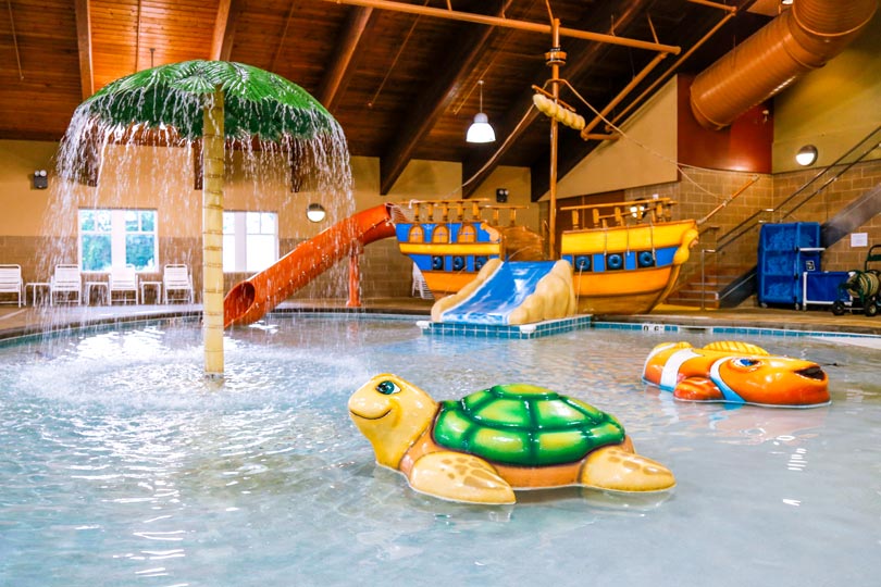 Buccanneer Bay, Honey Creek Resort's indoor water park, features fun water slides and various attractions