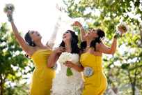 Bride and bridesmaids in a sunny yellow-themed wedding at Honey Creek Resort