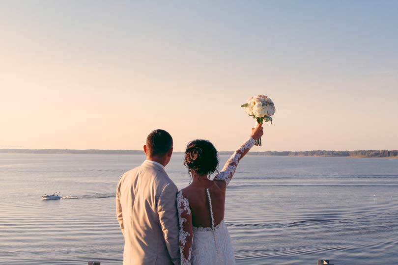 Bride and groom enjoying Rathbun Lake from Honey Creek Resort in Iowa