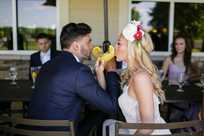 Bride and groom sharing drinks at their Honey Creek Resort wedding