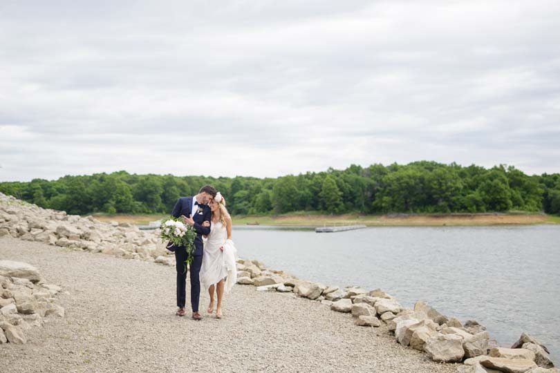 Bride and groom share a romantic moment on one of the trails near Honey Creek next to Rathbun Lake