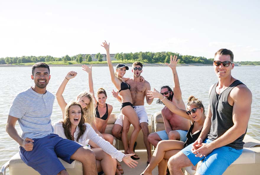 A group of friends enjoy boating on Rathbun Lake, one of the many activities Honey Creek has to offer