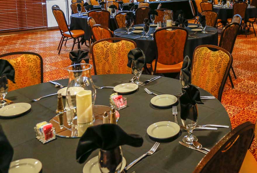 Tables are set up for a catered event at Honey Creek Resort