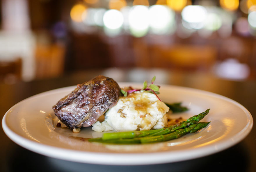 Beef short ribs are served with mashed potatoes and asparagus at Honey Creek Resort