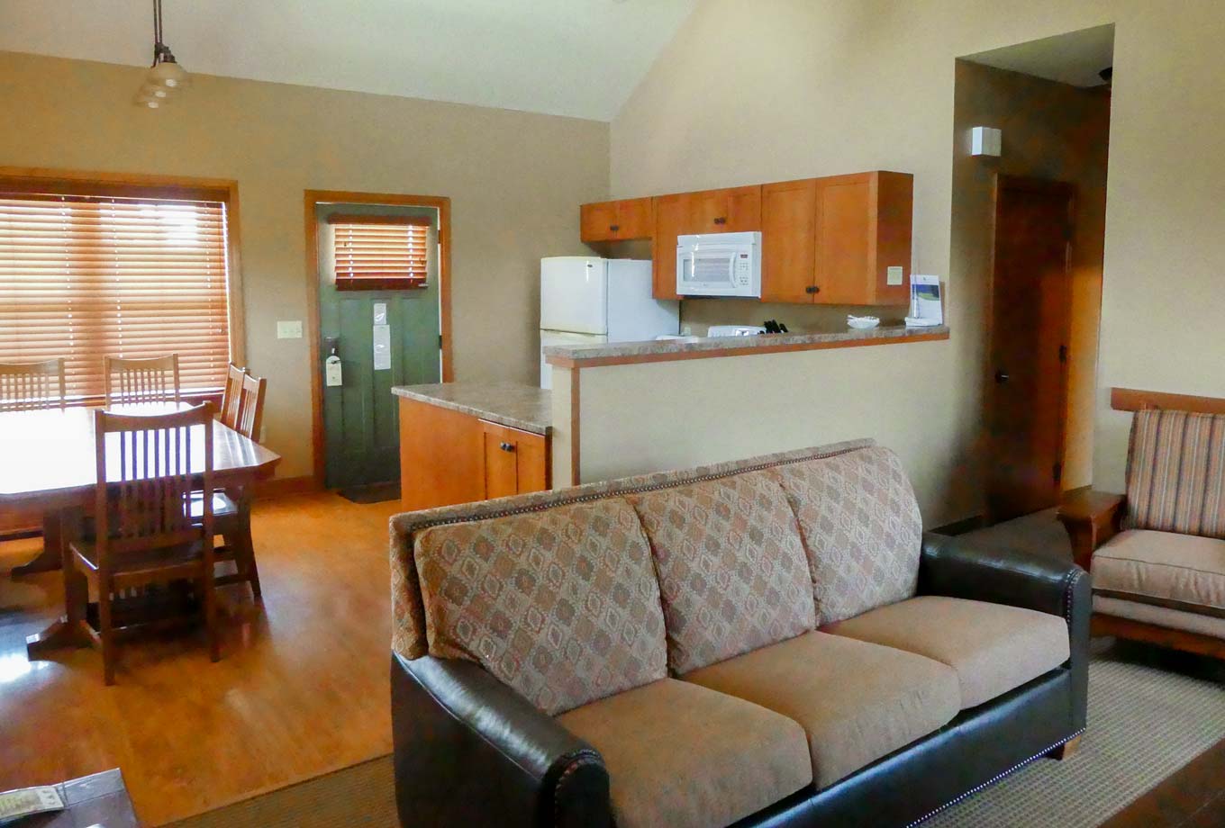 View of a living room and kitchen of a cottage at Honey Creek Resort