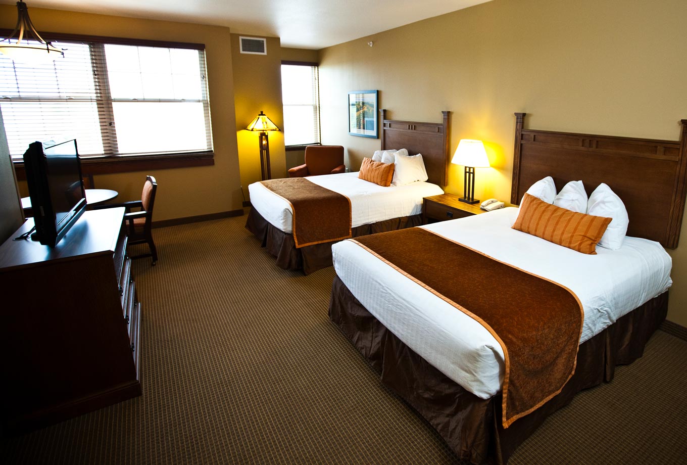 Two queen-size beds in Honey Creek Resort's spacious Signature Guest Rooms at the Lodge on Rathbun Lake