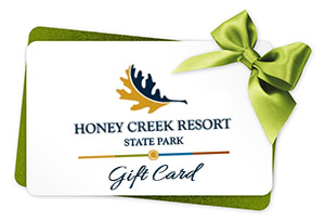 A green and white gift card is shown with Honey Creek Resort's logo